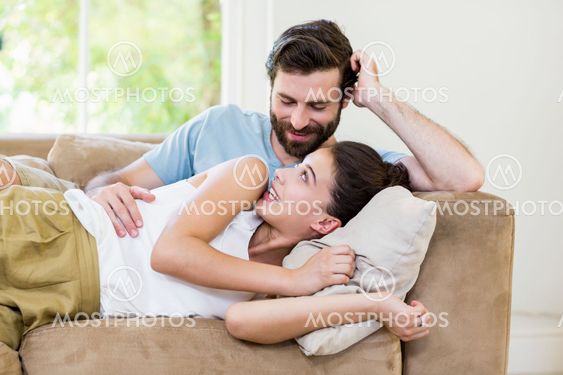 Young couple relaxing on sofa