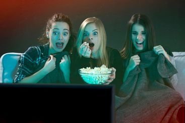 Scared teenage girls  watching movies