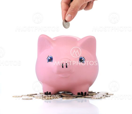 Savings. Pink piggy bank with coins around
