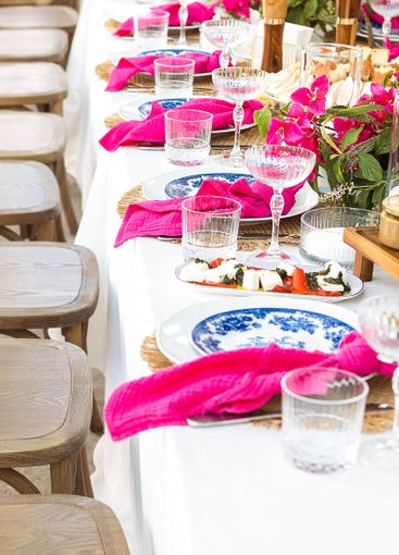 A set festive table in the open air. The table is...