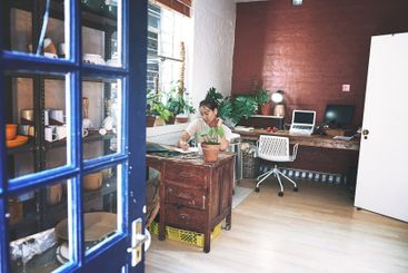 Pottery, planning and woman with writing in workshop for...