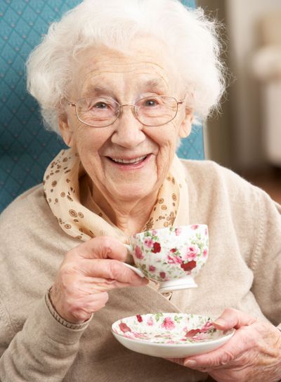 Senior Woman Enjoying Cup Of Tea At Home