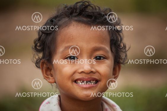 Portrait of smile asian poor girl in Thailand