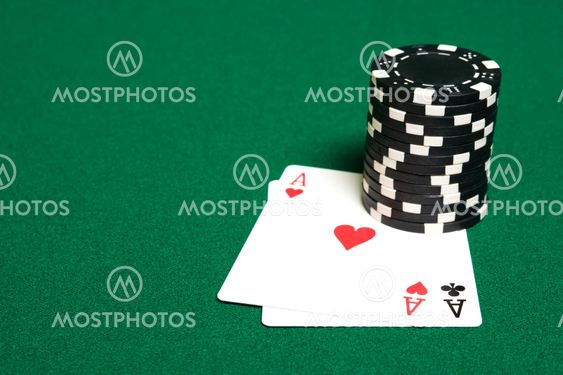 Stack of chips and two aces