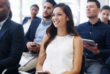 Event, smile and seminar with business woman at...