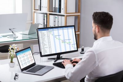 Businessman Analyzing Gantt Chart On Computer