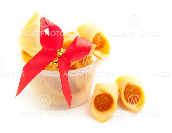 Cookies with pineapple jam on the white background