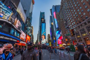 Evening crowd and digital billboards at Times Square 