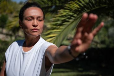Woman practicing concentration and balance in the...
