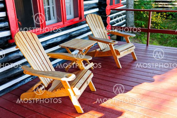 Log cabin porch with chairs