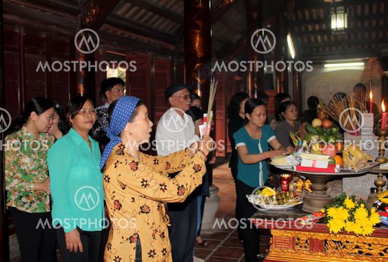 Group of people in traditional costume give gifts to the...