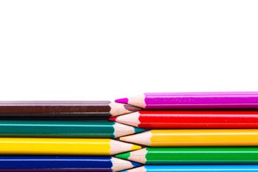 Colorful pencils arranged in a neat row showcasing...