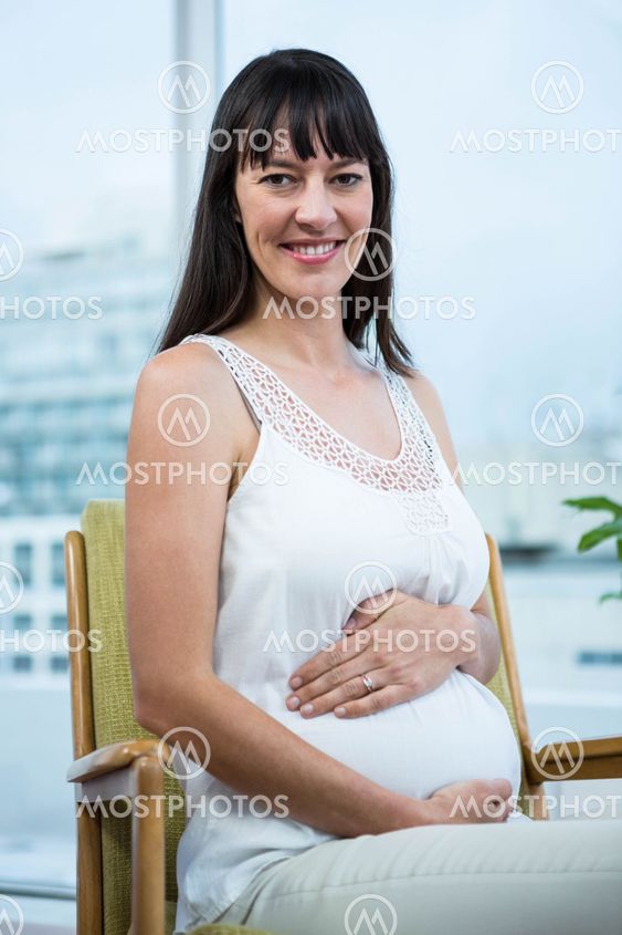 Pregnant woman sitting on chair