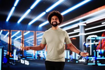 African American man shows strength by jumping rope