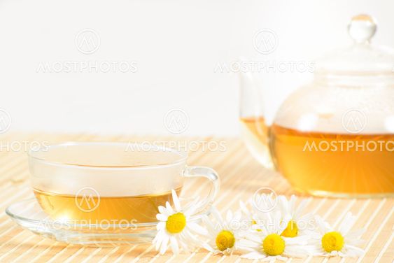 teacup with herbal chamomile tea