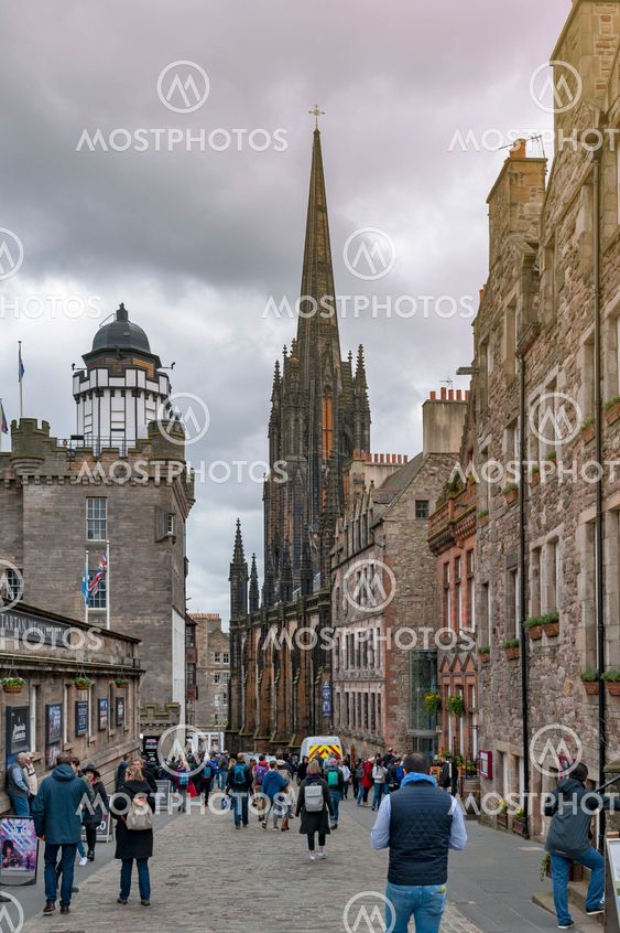 Edinburgh, Scotland - April 2018: Royal Mile, touristic street of Old Town Edinburgh City in Scotland, with Tron Kirk, former gothic church, now functioned as The Hub, a venue for various events and festivals