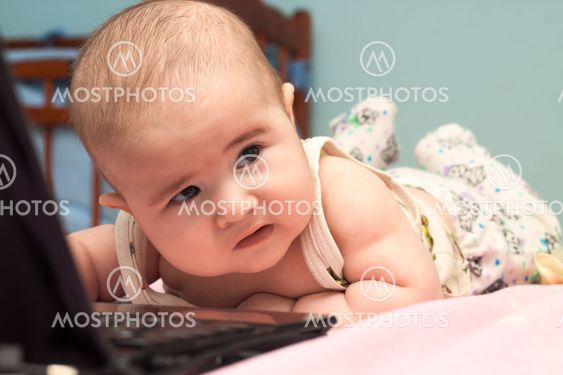 Small child using a laptop computer