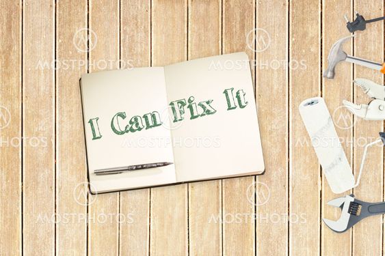 I can fix it against tools and notepad on wooden background