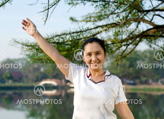 Happy woman smiling carefree and joyful in park