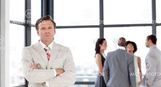 Attractive confident male manager leading his team