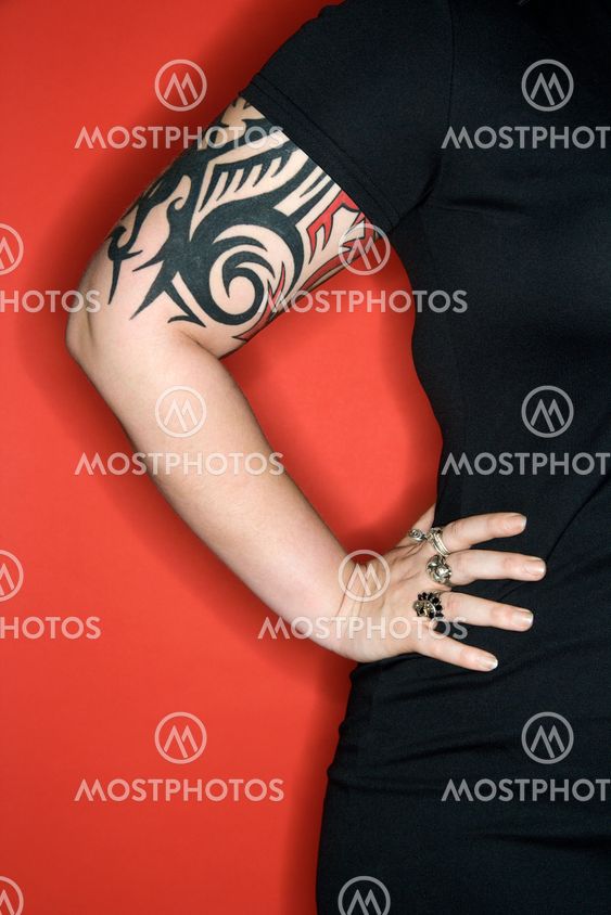 Tattooed woman arm.