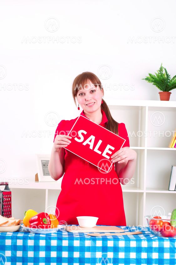 girl holding sale sign