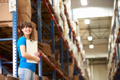 Female Worker In Distribution Warehouse