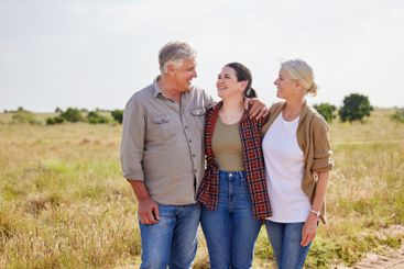 Family, smile and woman with senior parents, farm and...