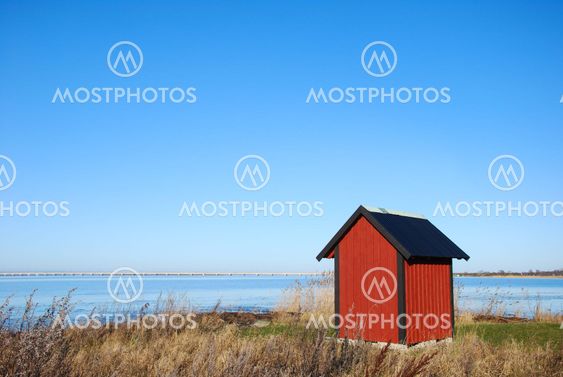 Red cabin by the sea