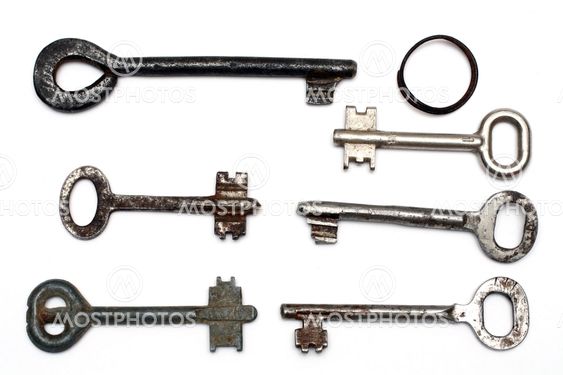 six old rusty keys and keyring