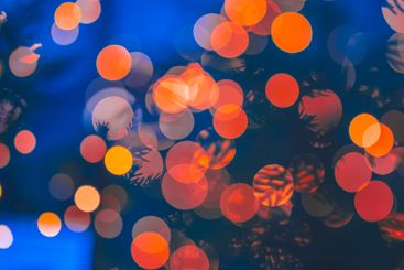 Out of focus christmas lights in blue evening light.