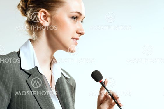 Portrait of a business woman with microphone