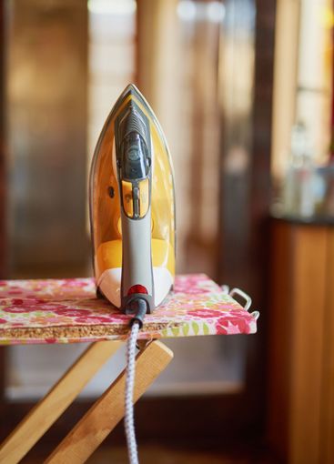 Ready to get rid of wrinkles. Still life shit of an iron...