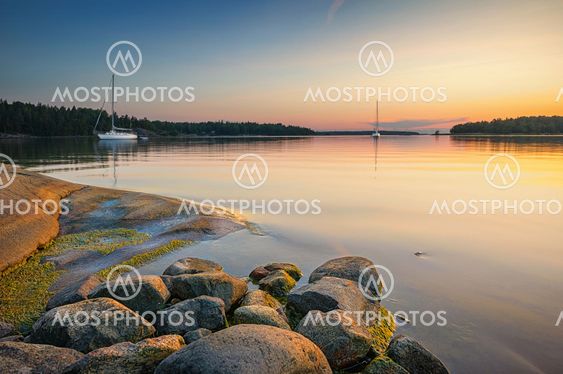 Tranquil scene with sailboats moored for the night