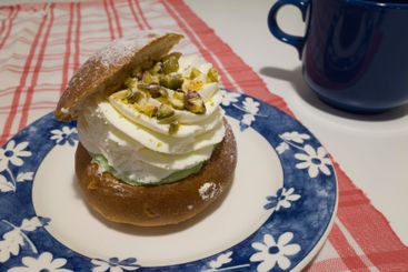 Swedish pistachio semla, shrove bun made of puff pastry