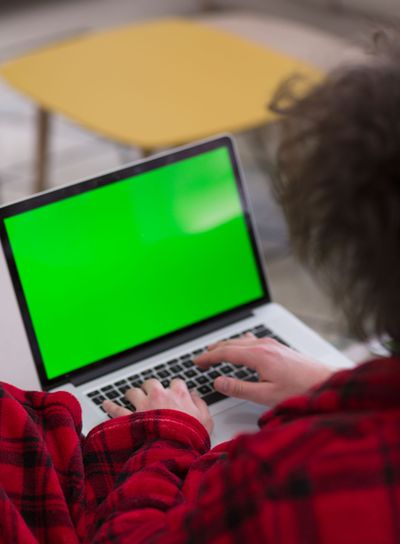 man freelancer in bathrobe working from home