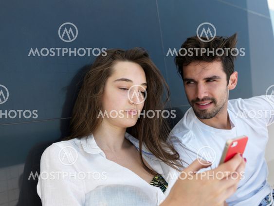 young couple making selfie together at home