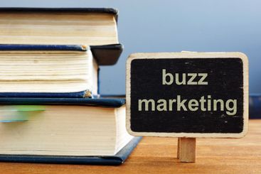 Text sign showing buzz marketing. The text is written on...