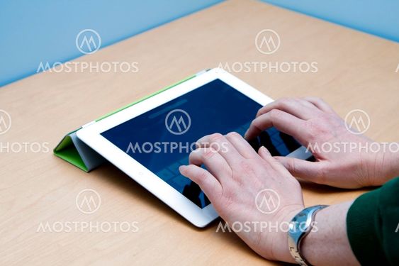 iPad 2 tablet user hands typing