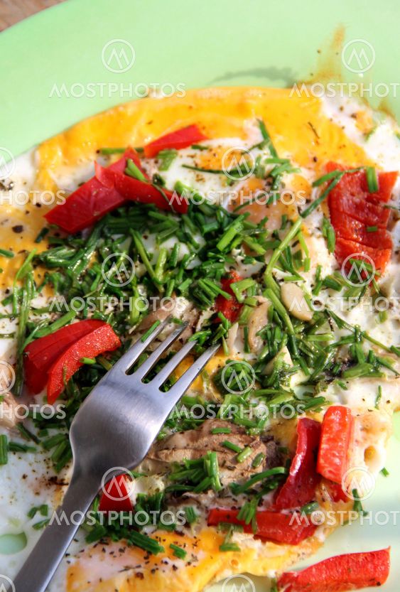 Omelet with mushrooms, onion and paprika