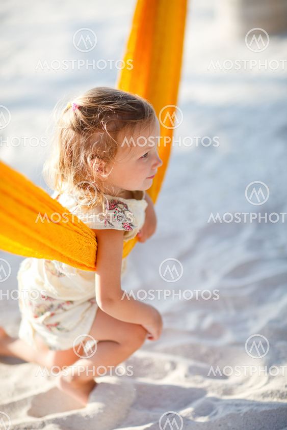 Cute little girl swinging in hammock