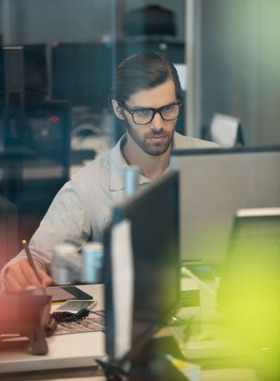 Concentrated businessman working on digitizer in office