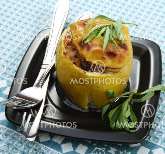 Apples stuffed with chicken, prunes and walnuts.