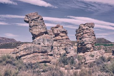 Outdoor, rocks and formation with plants in nature,...