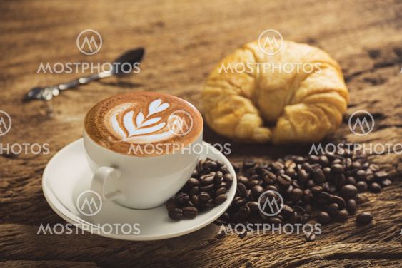 white coffee cup on wooden table