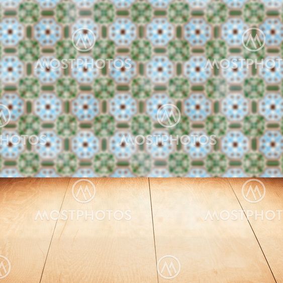 Wood table top and blur vintage ceramic tile pattern wall