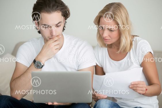 Young man and woman working with laptop