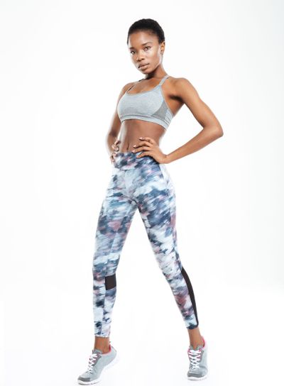 Full length portrait of a sporty afro american woman