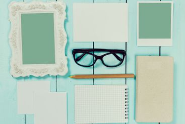 Array of blank stationery and personal items arranged on...