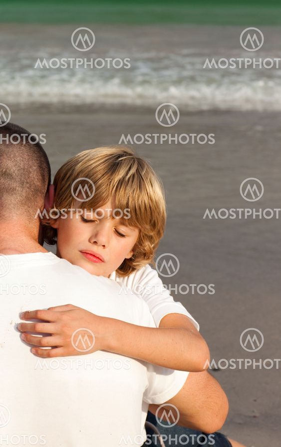Portrait of a Young Boy Hugging his father